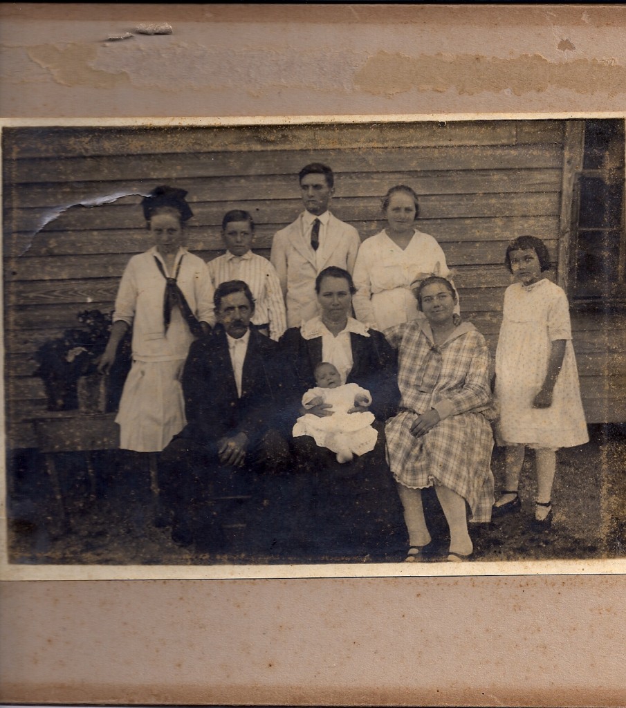 Top Row L-R: Ola, Allen, John Owen Sr., Alma (Duckett) Owen. Bottom Row L-R: Selma Duckett, Seady (Childs) Duckett holding Lavelle, Ottie, Bonnie. Courtesy Clara Lou Queen Owen. Likely late summer 1917.